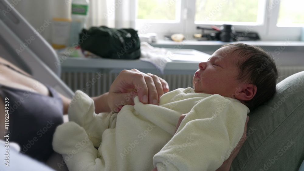 Newborn baby peacefully resting on mother’s lap in hospital bed. serene expression on the baby's face and the comforting embrace of the mother highlight the warmth and security of their bond Newborn baby peacefully resting on mother’s lap in hospital bed. serene expression on the baby's face and the comforting embrace of the mother highlight the warmth and security of their bond