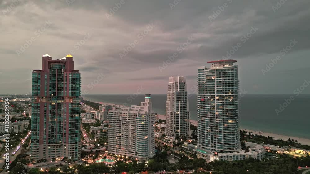 Luxury skyscraper in Miami, Florida. City skyline in evening sunset. Aerial cityscape. Miami South beach at night. Aerial view on skyscraper cityscape at night. Night city aerial view. Aerial footage Luxury skyscraper in Miami, Florida. City skyline in evening sunset. Aerial cityscape. Miami South beach at night. Aerial view on skyscraper cityscape at night. Night city aerial view. Aerial footage