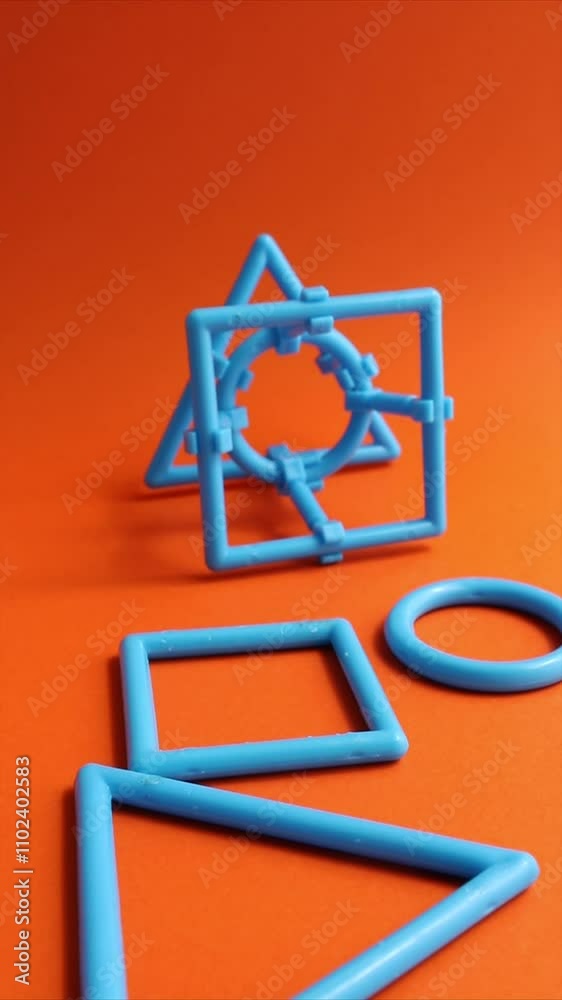 Triangle, circle and square fall in front of a composite figure with these three geometric shapes Triangle, circle and square fall in front of a composite figure with these three geometric shapes