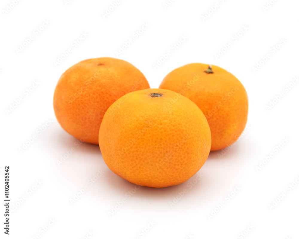Three fresh tangerines in a cluster on white background Three fresh tangerines in a cluster on white background