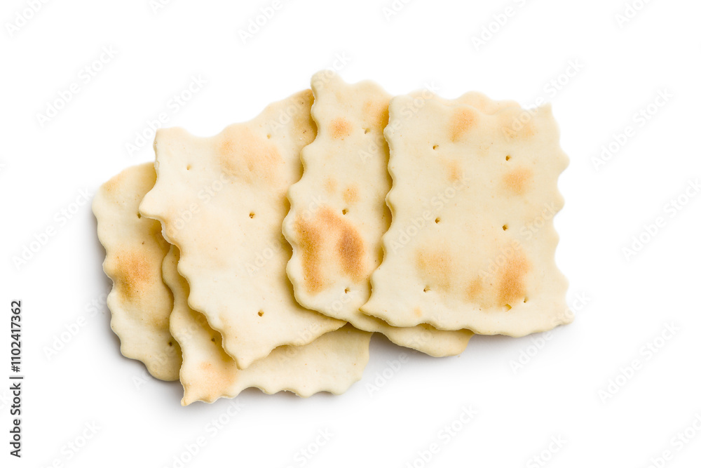 A crispy salted crackers isolated on white background. A crispy salted crackers isolated on white background.