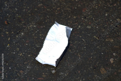 empty gum wrapper on the ground
