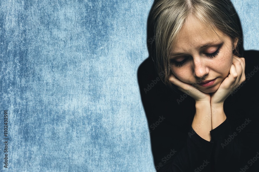 Pensive young caucasian female against blue background Pensive young caucasian female against blue background