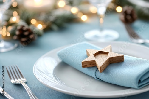 Beautiful table setting in white and blue colors with tablecloth and candles decorated with David star and green branches. Celebrating Hanukkah, Rosh Hashanah, New Year, Christmas, Passover, Shavuot photo