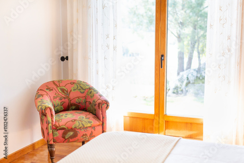 Принти на полотні Natural wooden double glazed door in a bedroom with low chair upholstered with g