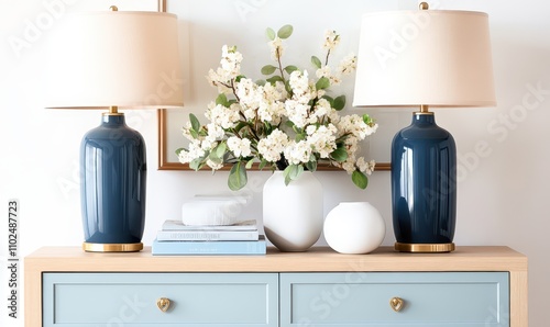 Wallpaper Mural Elegant blue table lamps on a light wooden sideboard with fresh flowers and decorative elements Torontodigital.ca