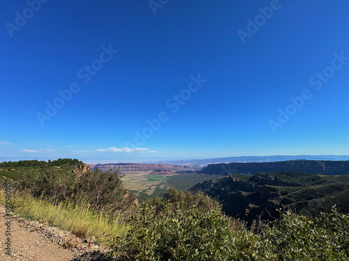 Mesa view red rocks blue sky with clouds Moab Utah