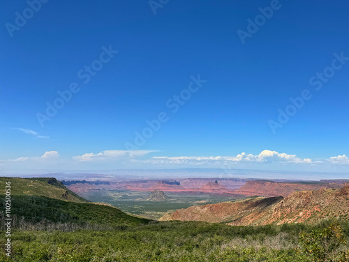 Mesa view red rocks blue sky with clouds Moab Utah