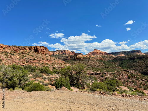 Mesa view red rocks blue sky with clouds Moab Utah