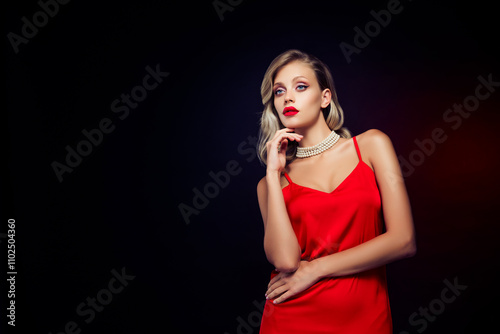 Photo of stunning model actress star wear posing in red dress isolated on dark color background