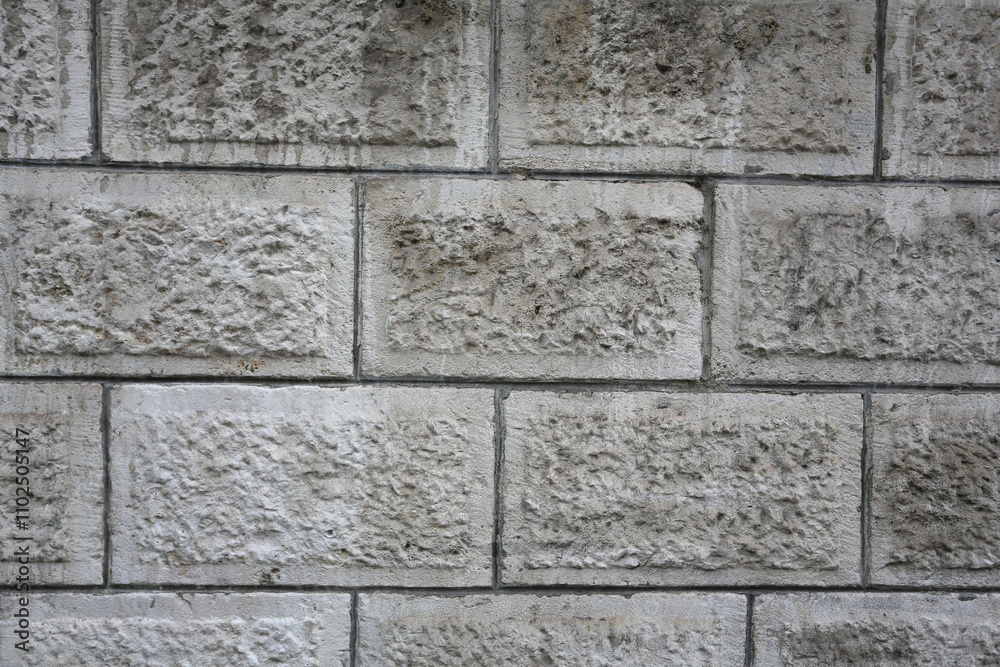 Naklejka premium Mur de pierres texturé en relief
