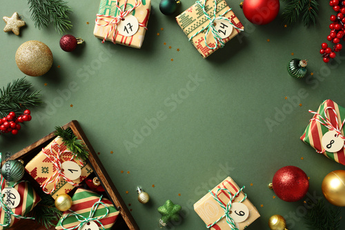 Vintage Christmas gifts from advent calendar on green background. photo