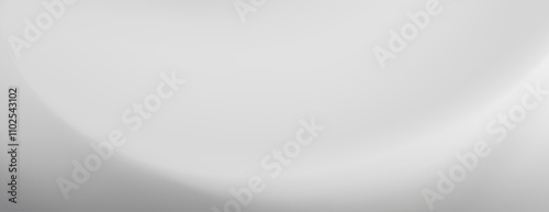 A minimalist image featuring a smooth gray gradient.