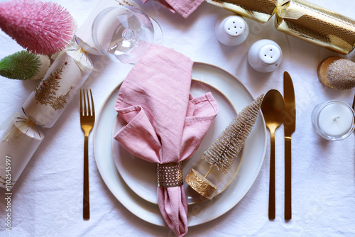 Christmas Dinner Table Setting in Modern Pink, White and Gold Theme, Close Up.