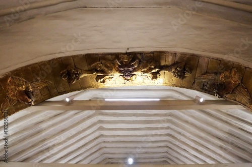 Tópaga, Boyacá, Colombia - December 28, 2023: Wooden Image of the devil carved in an arch of the Church of the Immaculate Conception in Tópaga. photo