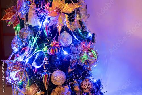 christmas tree decoration. christmas tree with garland and illuminating  lights. Merry Christmas and happy new year