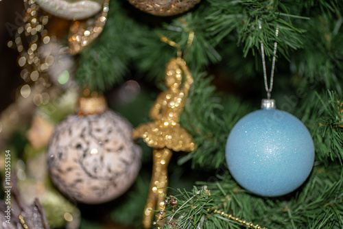 it is a boy. christmas tree decorated with blue ball bauble by pregnant women expecting baby boy son