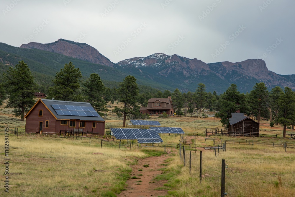 Sustainable Homestead in Mountain Landscape with Solar Panels Sustainable Homestead in Mountain Landscape with Solar Panels