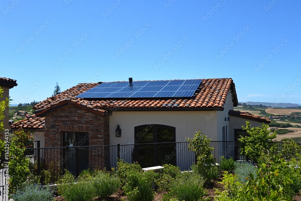 Modern Home with Solar Panels on Rooftop Under Clear Blue Sky Modern Home with Solar Panels on Rooftop Under Clear Blue Sky