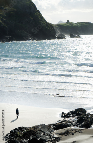 Traeth Llyfn beach and cliffs on Pembrokeshire Coast Path near Porthgain, Pembrokeshire, Wales. S.W. toward Abereiddi Tower photo