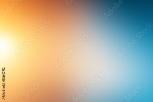 A blurry photo of a sun with a yellow and orange background