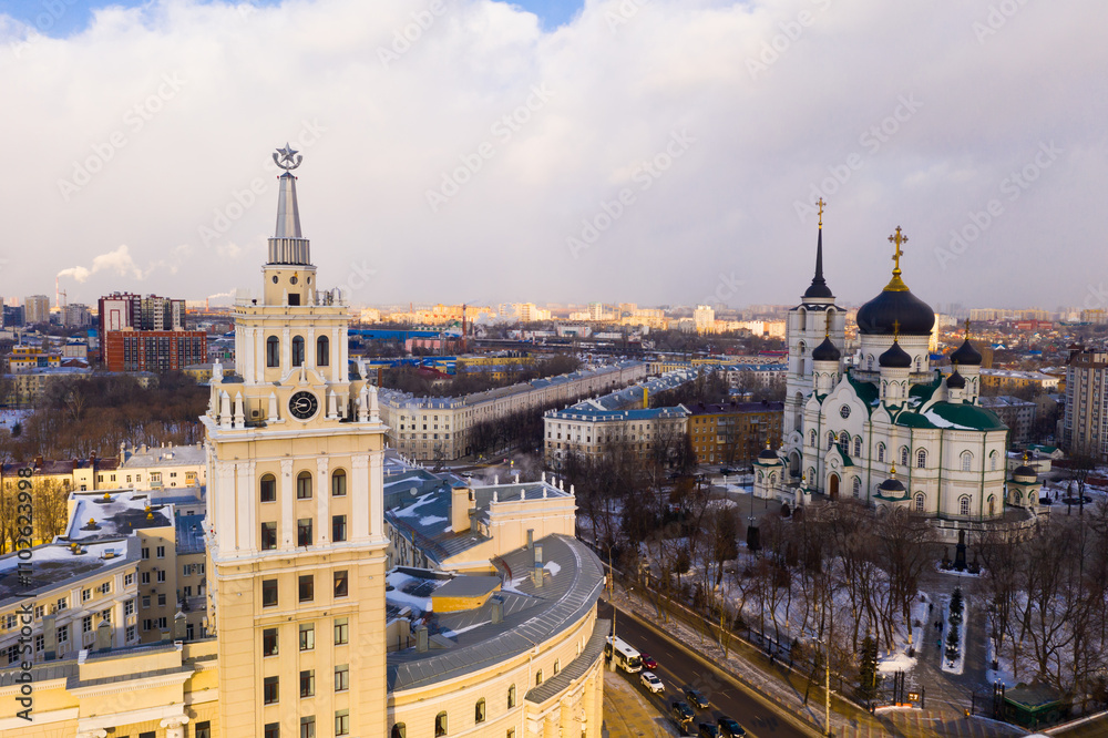 Fototapeta premium Cathedral of the Annunciation and the clock tower of the South-Eastern Railway building frome drone in Voronezh, Russia