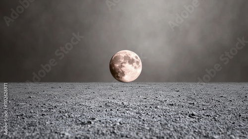 Softly glowing Earth rises above a desolate lunar landscape during twilight photo