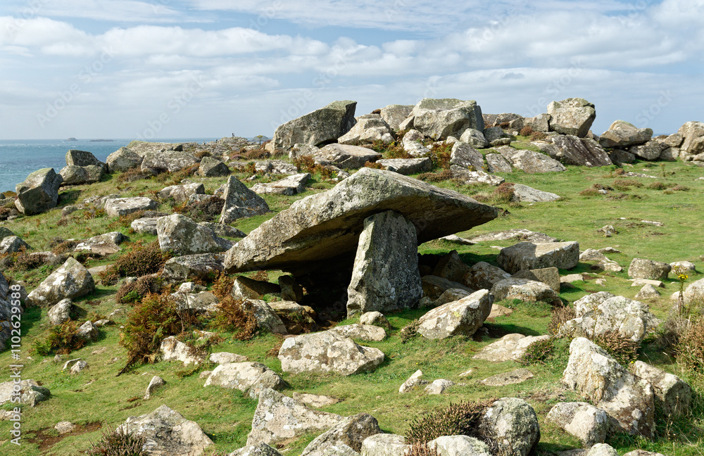 Coetan Arthur prehistoric megalithic Neolithic burial chamber dolmen on St. Davids Head, Pembrokeshire, Wales. View west to St. Georges Channel