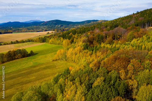 Obraz na plátně Picturesque view of country landscape with colorful trees on hillsides in autumn