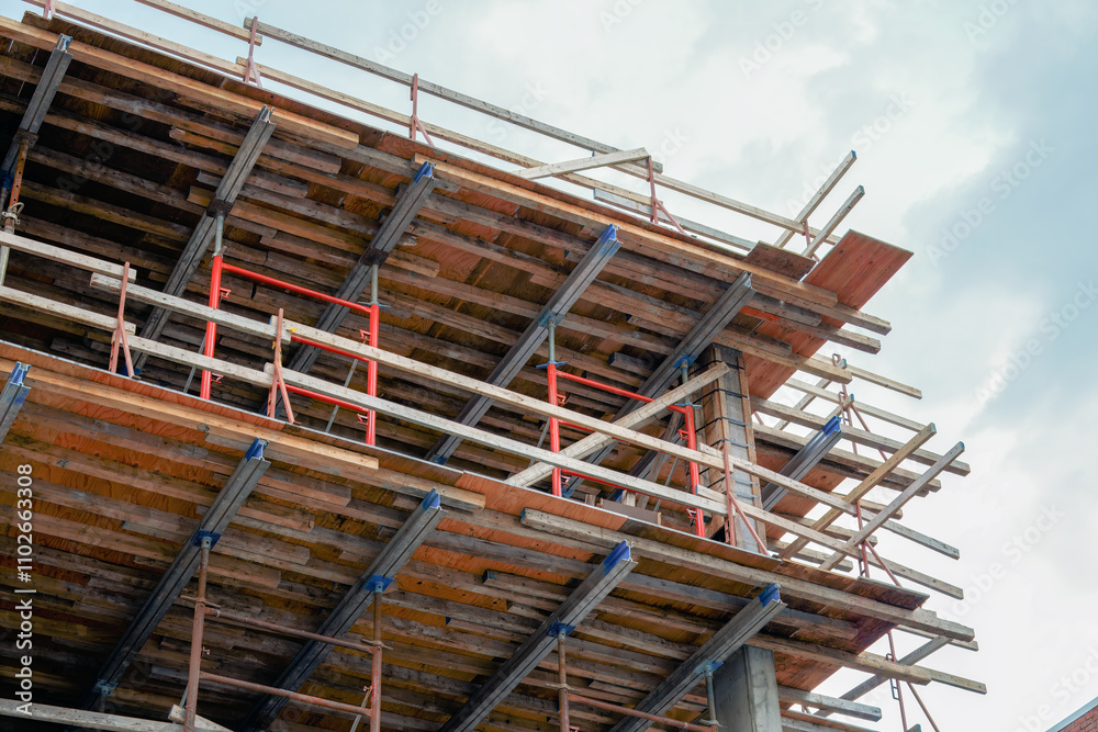 Concrete Building Under Construction with Wooden Formwork Concrete Building Under Construction with Wooden Formwork