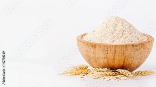 A bowl of flour with wheat grains, white isolated background. photo