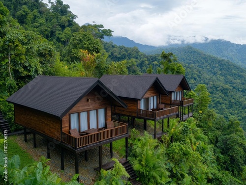 Eco-friendly retreat featuring natural architecture mountain landscape image of rustic cabins tranquil environment aerial view sustainable living