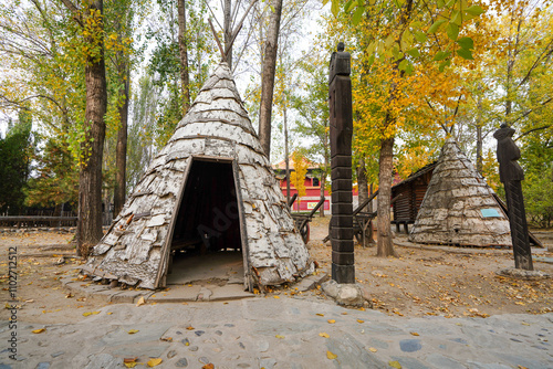 Birch bark immortal column of Oroqen people traditional folk house in China Ethnic Museum. photo