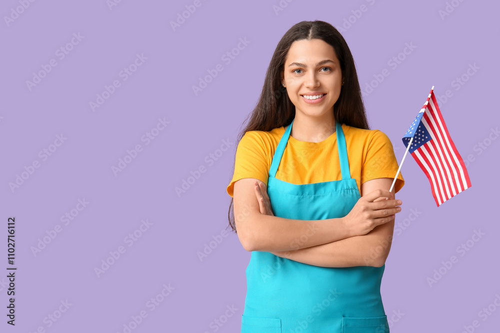 Female janitor with USA flag on lilac background Female janitor with USA flag on lilac background