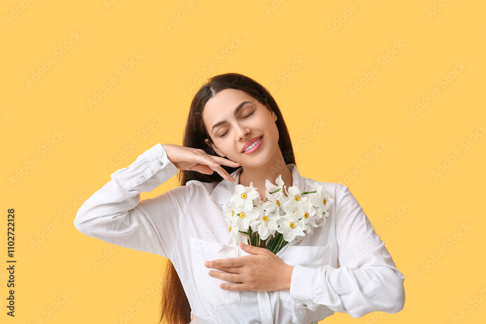 Beautiful young woman with bouquet of white daffodil flowers on yellow background Beautiful young woman with bouquet of white daffodil flowers on yellow background