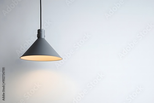 Black Cone Pendant Light on gray Wall

