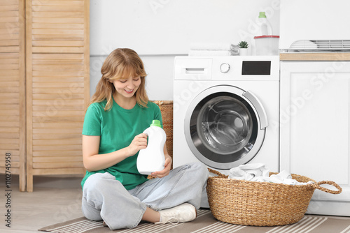 Young woman with laundry ba...