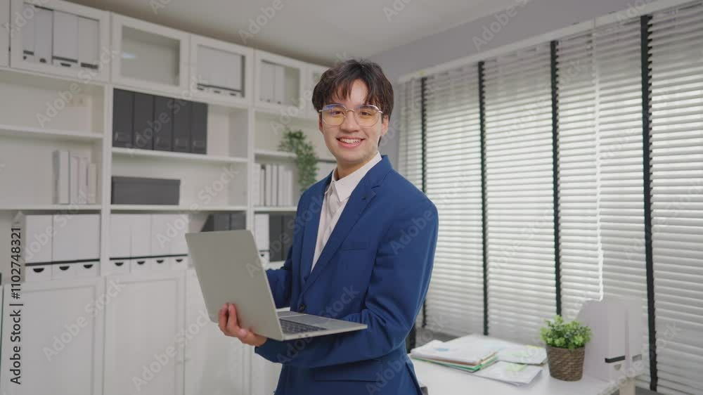 Portrait of Asian young businessman working in the office workplace. 