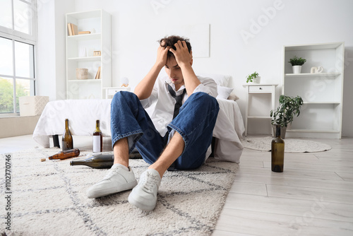 Drunk young man at home. Al...