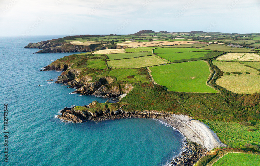 North over Aber Bach beach from the Cable Hut along the Irish Sea coast of Pembrokeshire at Granston, Wales. Pembrokeshire Coast Path. Aerial summer