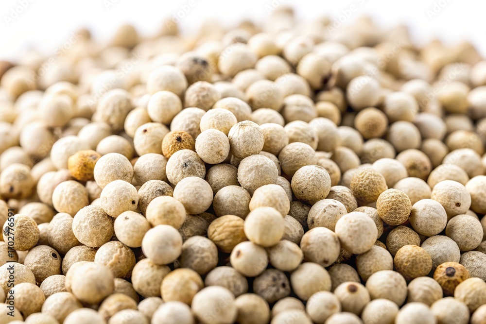 Macro photography captures the delicate beauty of white peppercorns, isolated against a clean, white background. Macro photography captures the delicate beauty of white peppercorns, isolated against a clean, white background.