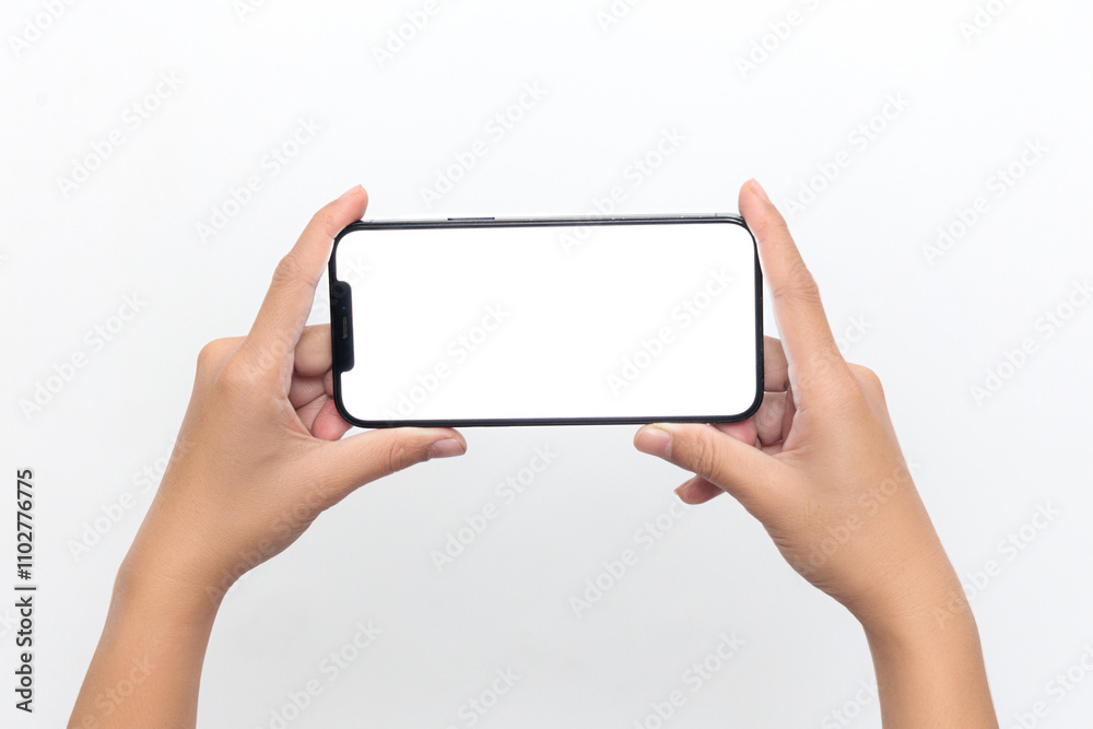 A person is holding a phone with a white screen A person is holding a phone with a white screen