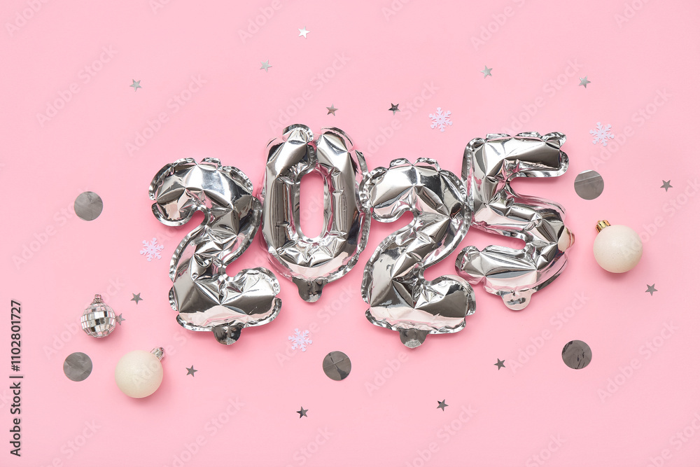 Figure 2025 made of foil balloons with Christmas balls and confetti on pink background Figure 2025 made of foil balloons with Christmas balls and confetti on pink background