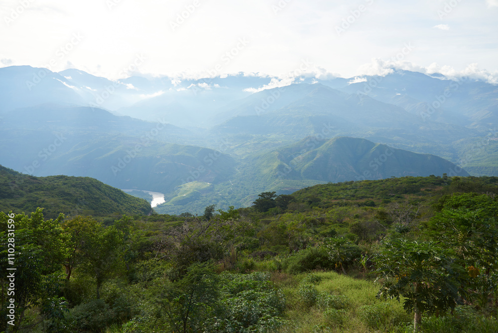 Naklejka premium Colombian Andean landscape, mountains covered with lush, green vegetation. View from a lookout point in Guane, Santander.