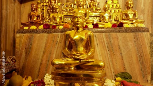 Mysuru, Karnataka, India-September 15 2024; A Divine view of Lord Mahavira and other deities sculptured in bronze metal at a Jain temple in India.
 photo