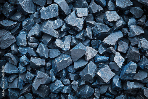 Rugged blue basalt rocks create striking texture, showcasing their unique shapes and colors. This natural material is perfect for landscaping and decorative purposes photo