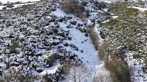 Aerial video of freezing fog on the snowy beautiful and spectacular Rolling hills of the Glens of Antrim Northern Ireland photo