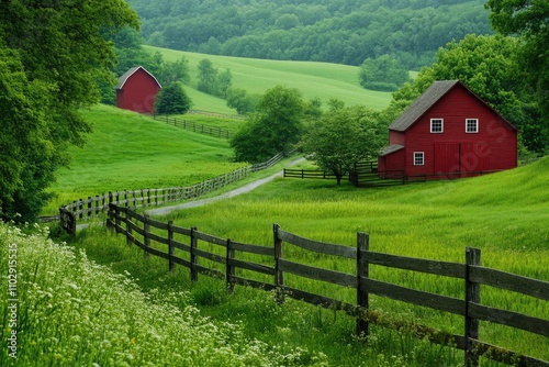 Serene countryside with red barns and lush green fields.