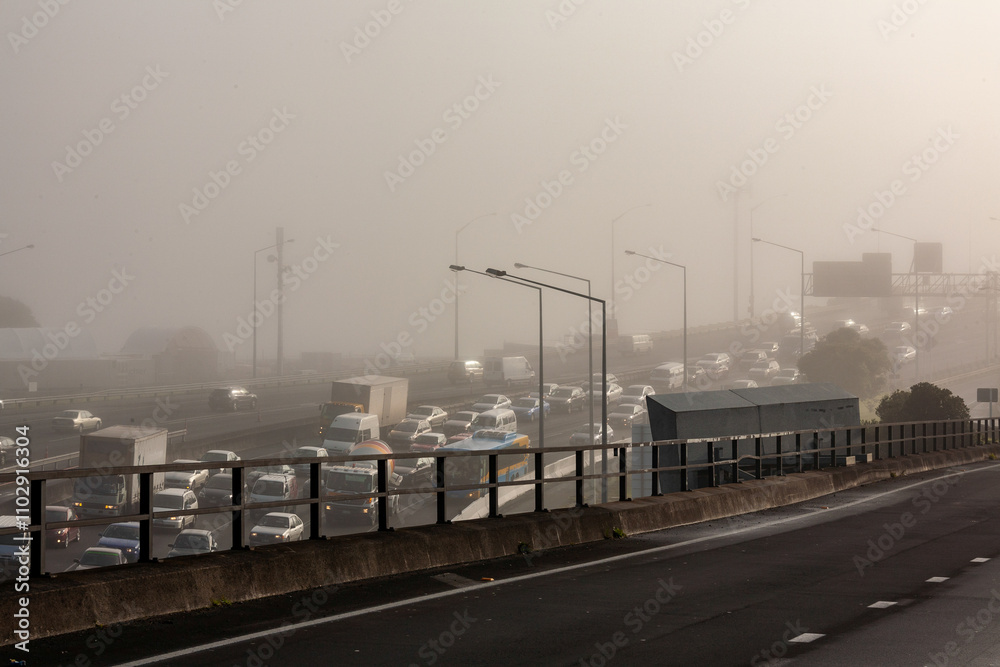 Fototapeta premium cars freeway onramp bridge heavy foggy morning