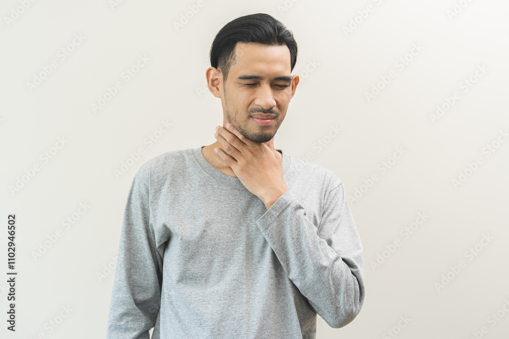 Sick, hurt asian young man sore throat pain, have a fever, flu check self touching massage neck. Male painful and infection isolated on white background. Healthcare medical of influenza virus seasonal Sick, hurt asian young man sore throat pain, have a fever, flu check self touching massage neck. Male painful and infection isolated on white background. Healthcare medical of influenza virus seasonal